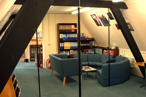 Main lecture room, showing the other end with relaxing area and the Teams extensive archive library.