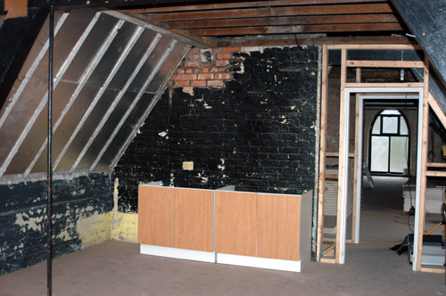 The kitchen units in place, awaiting the water and electrical connections.