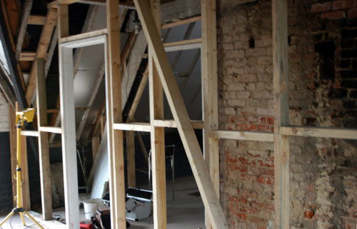 Partition wall and entrance into the office area and main lecture room.